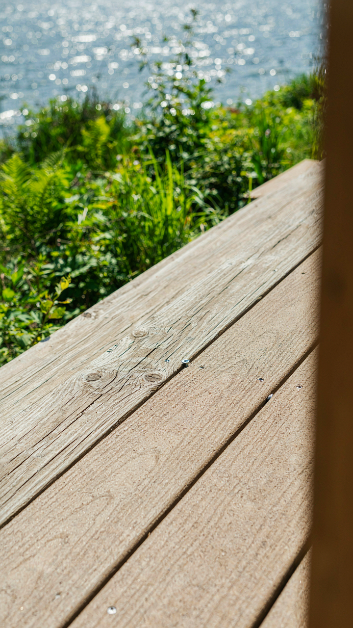 Close-up of durable construction materials for a lake house, like treated lumber and composite