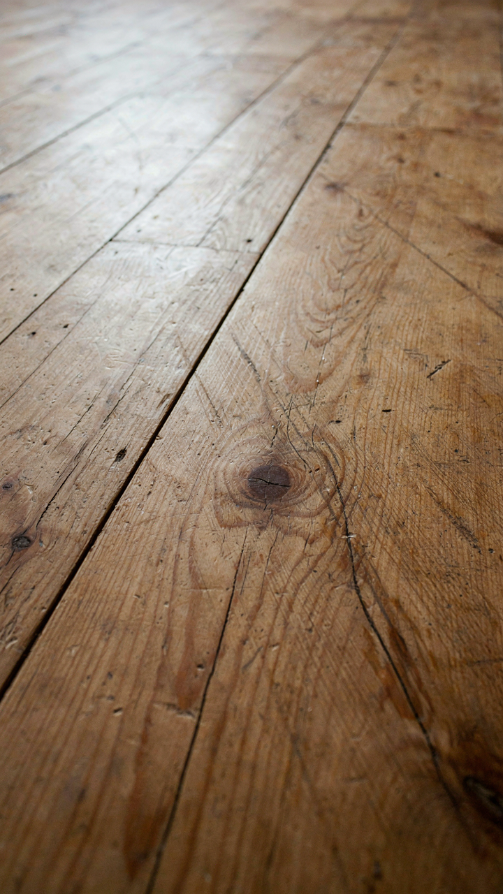 Close-up of old, weathered heart pine floorboards.