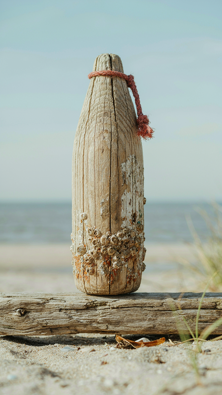 An old wooden fishing float shows genuine age and texture.