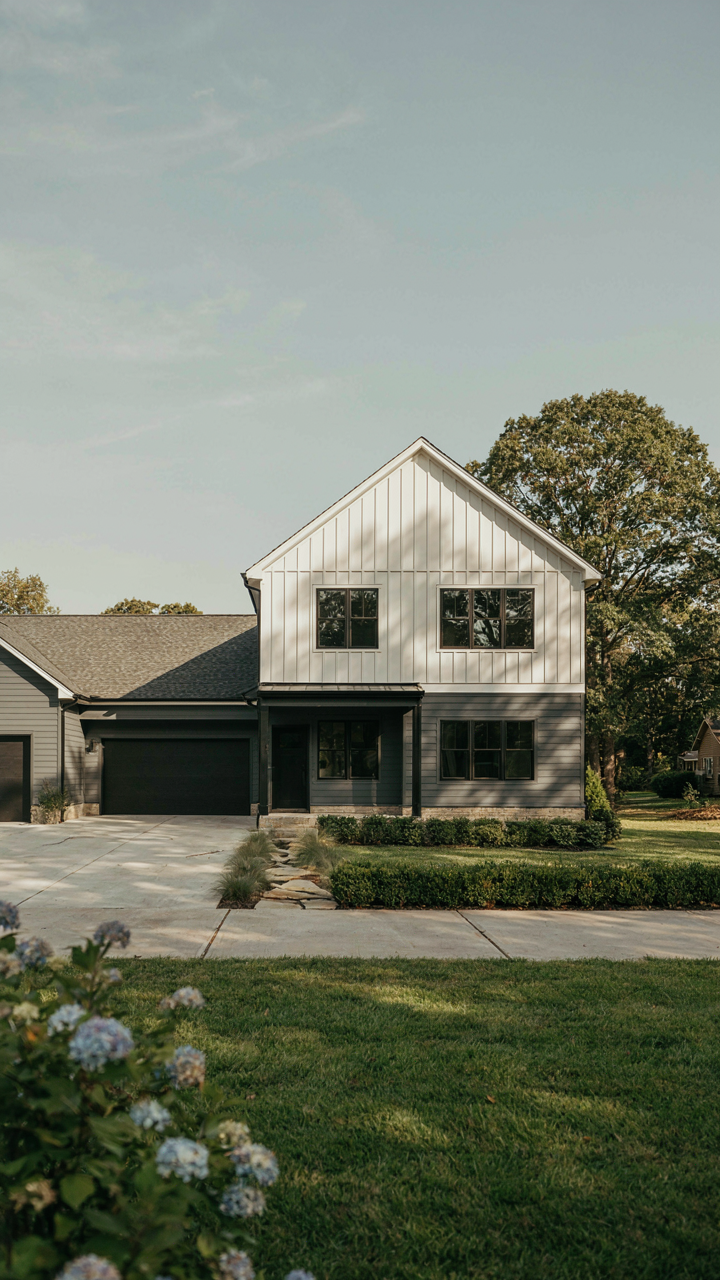 A modern farmhouse with a garage perfectly integrated into the main structure.