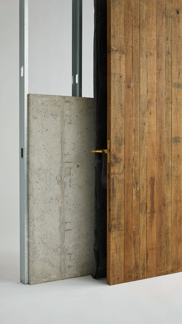 A cross-section diagram shows a shower wall with a moisture barrier behind wood.