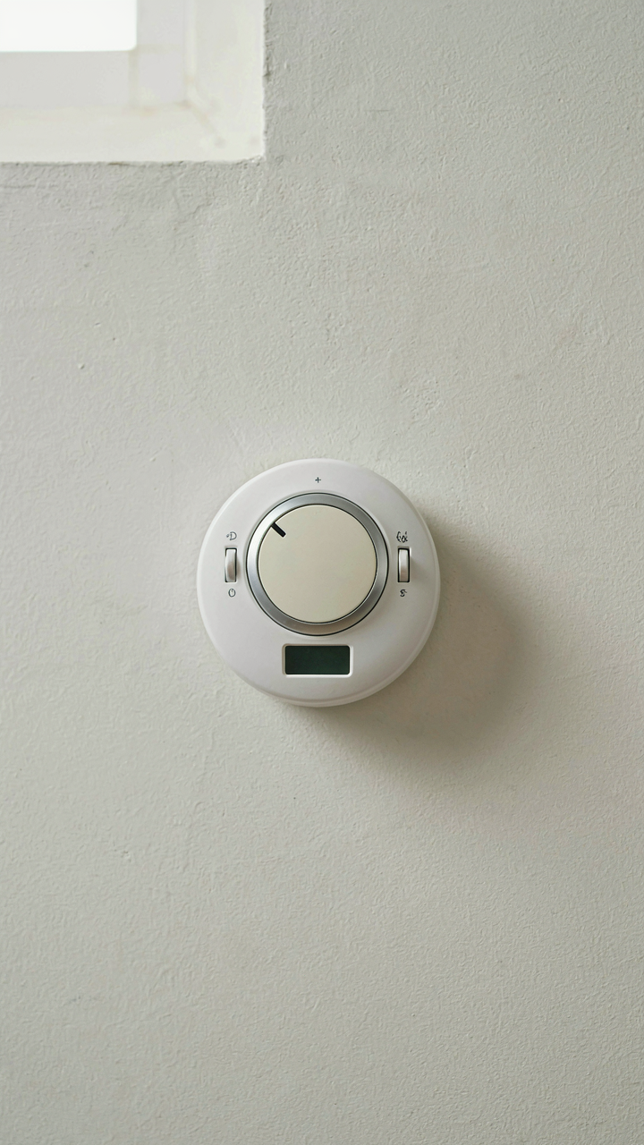 A classic thermostat with a large, easy-to-read dial for simple control.