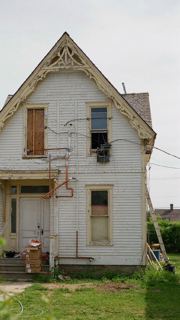 A charming cottage exterior showing construction elements that suggest hidden inefficiencies.