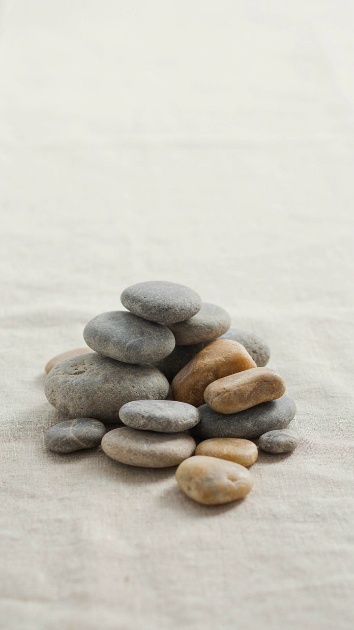A collection of smooth, grey and honey-colored stones from the Cotswolds.