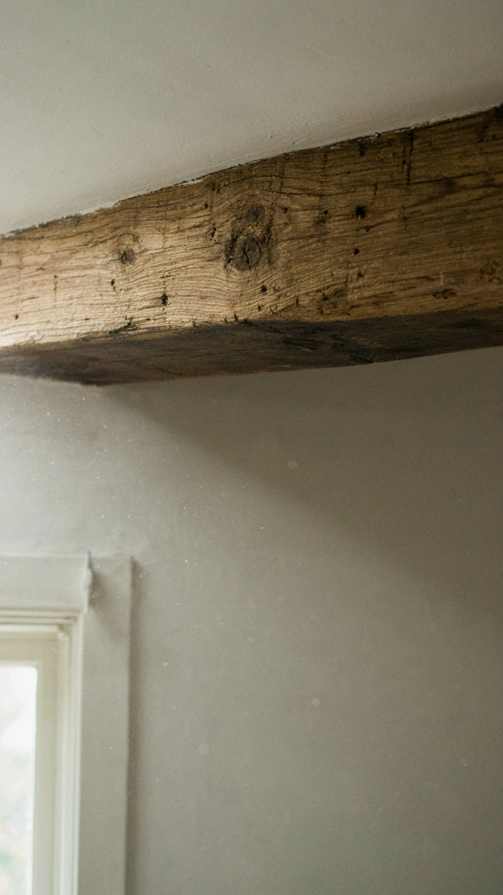 A faux cottage ceiling beam with a darker underside creating a shadow.