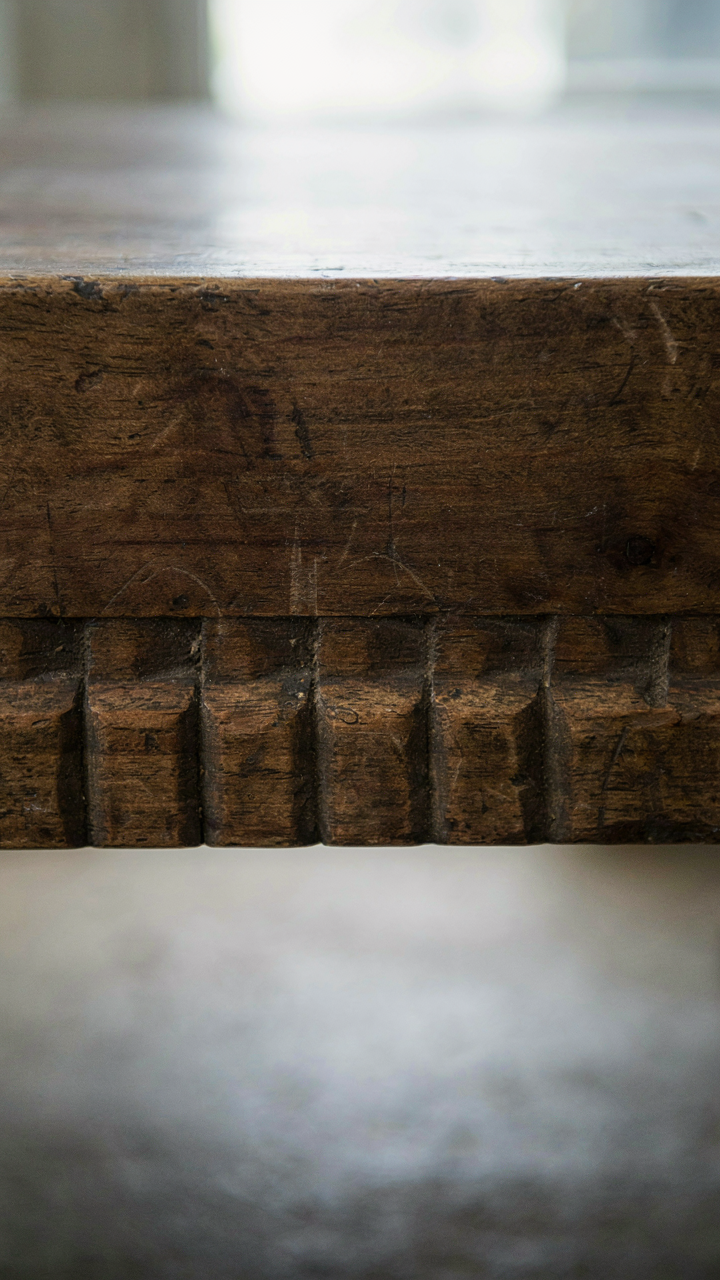 Underside of an antique French country drawer showing hand-cut dovetail joints.