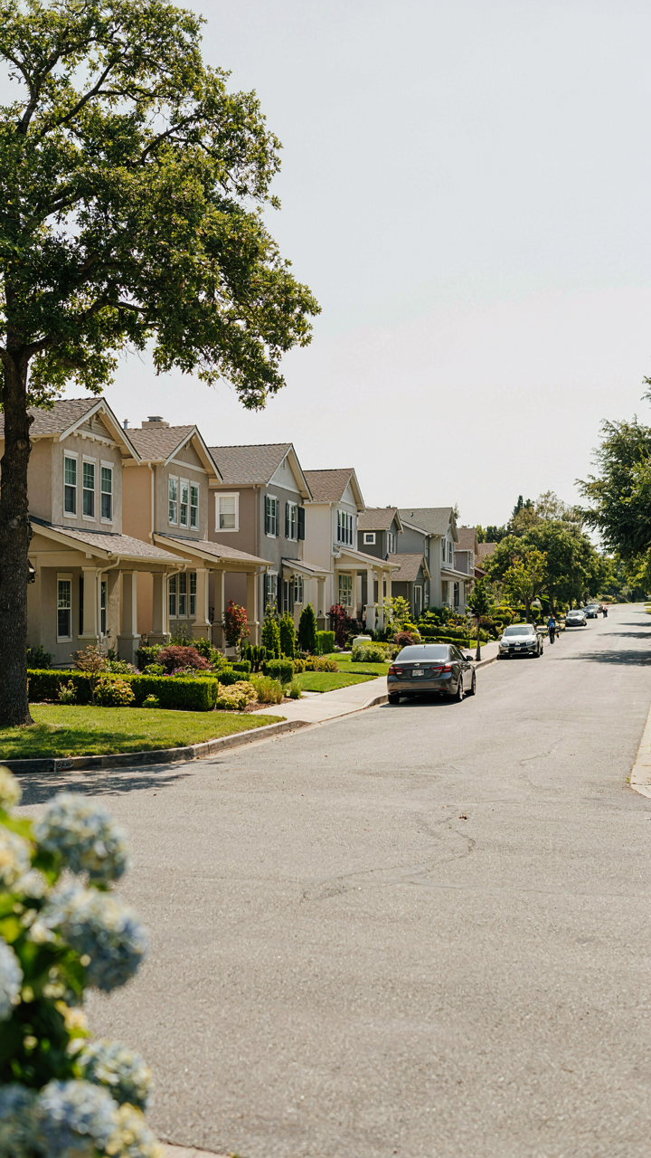 Several craftsman homes on a street with very similar, muted exterior colors.