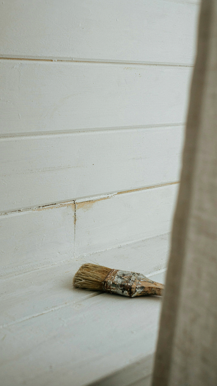 Close up of discolored shiplap joints, showing signs of moisture damage.