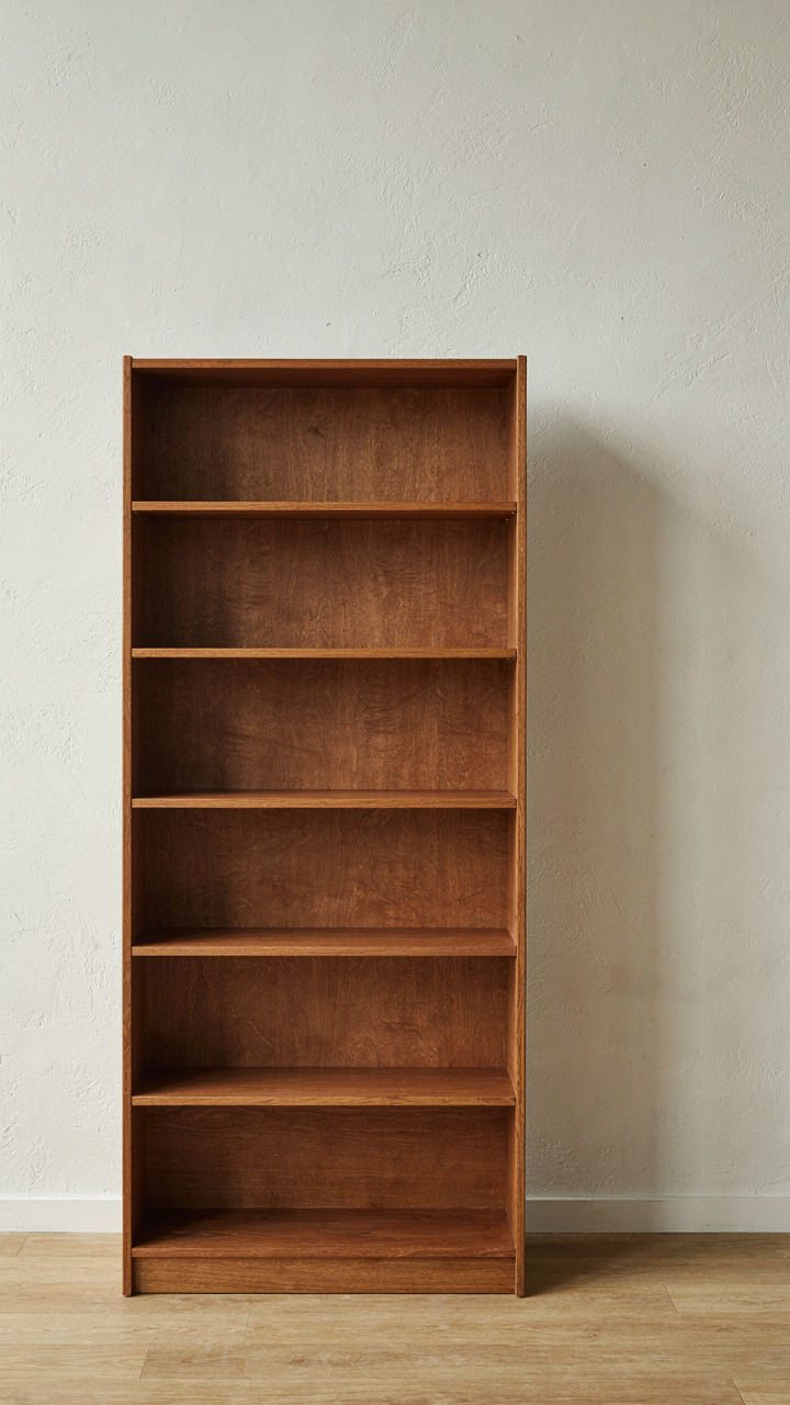 A single, beautifully crafted walnut bookshelf with mortise-and-tenon joinery.